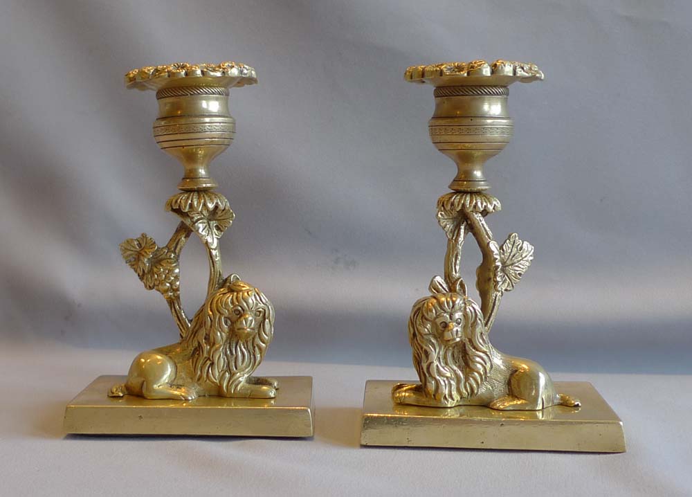 Pair English Regency naïve ormolu candlesticks with King Charles spaniels.