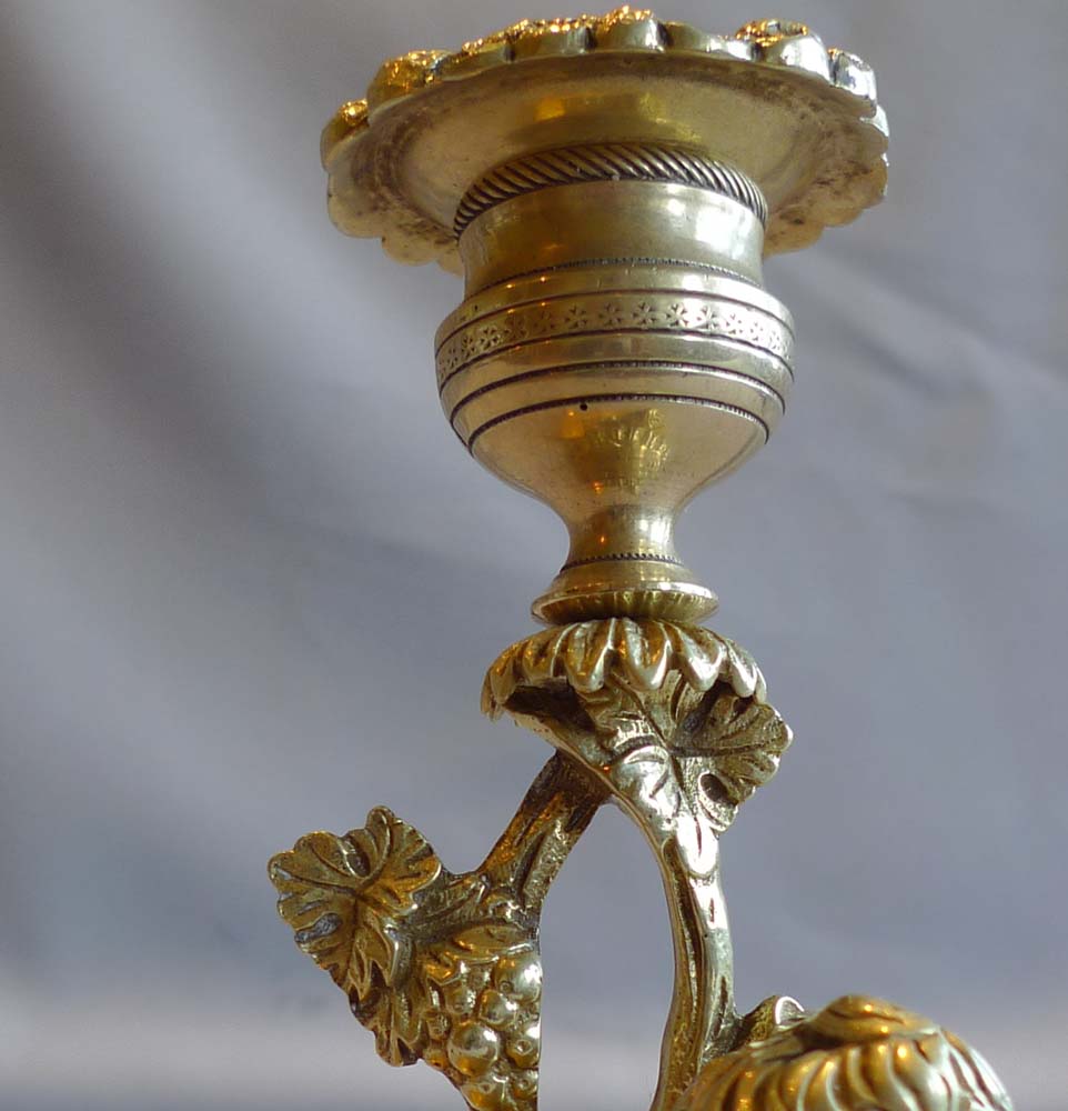 Pair English Regency naïve ormolu candlesticks with King Charles spaniels.