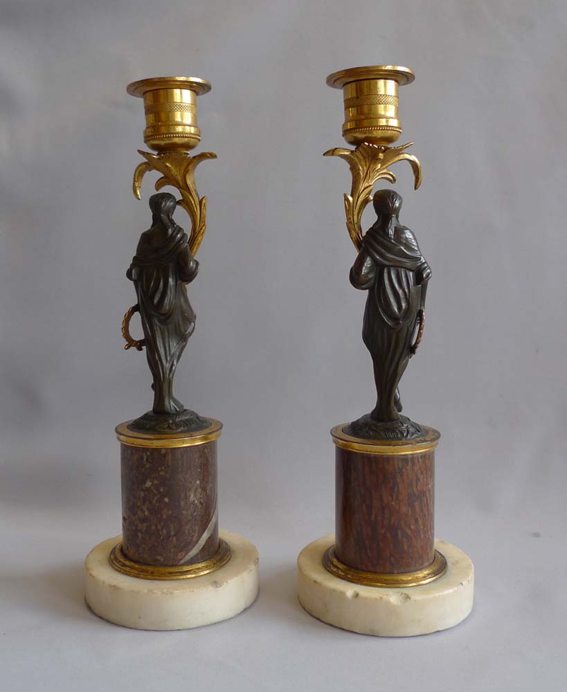 Pair English late 18th century marble, ormolu and patinated bronze figural candlesticks.
