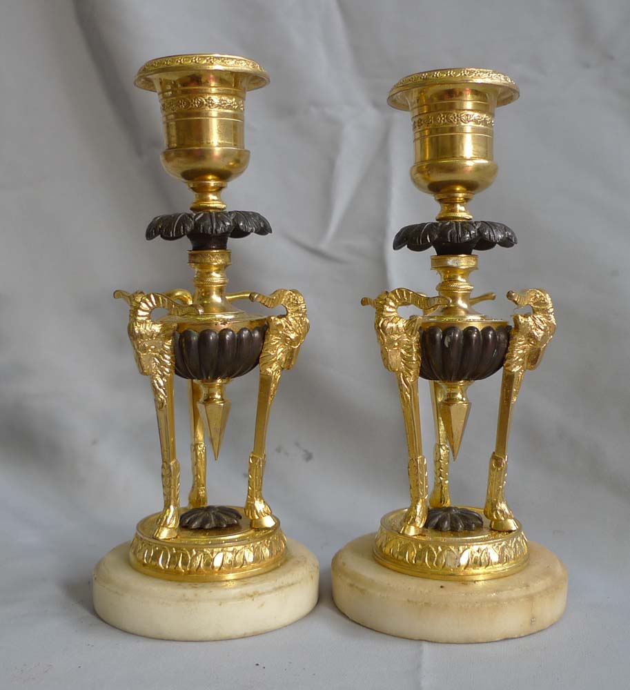 Pair antique candlesticks in ormolu, patinated bronze and marble.