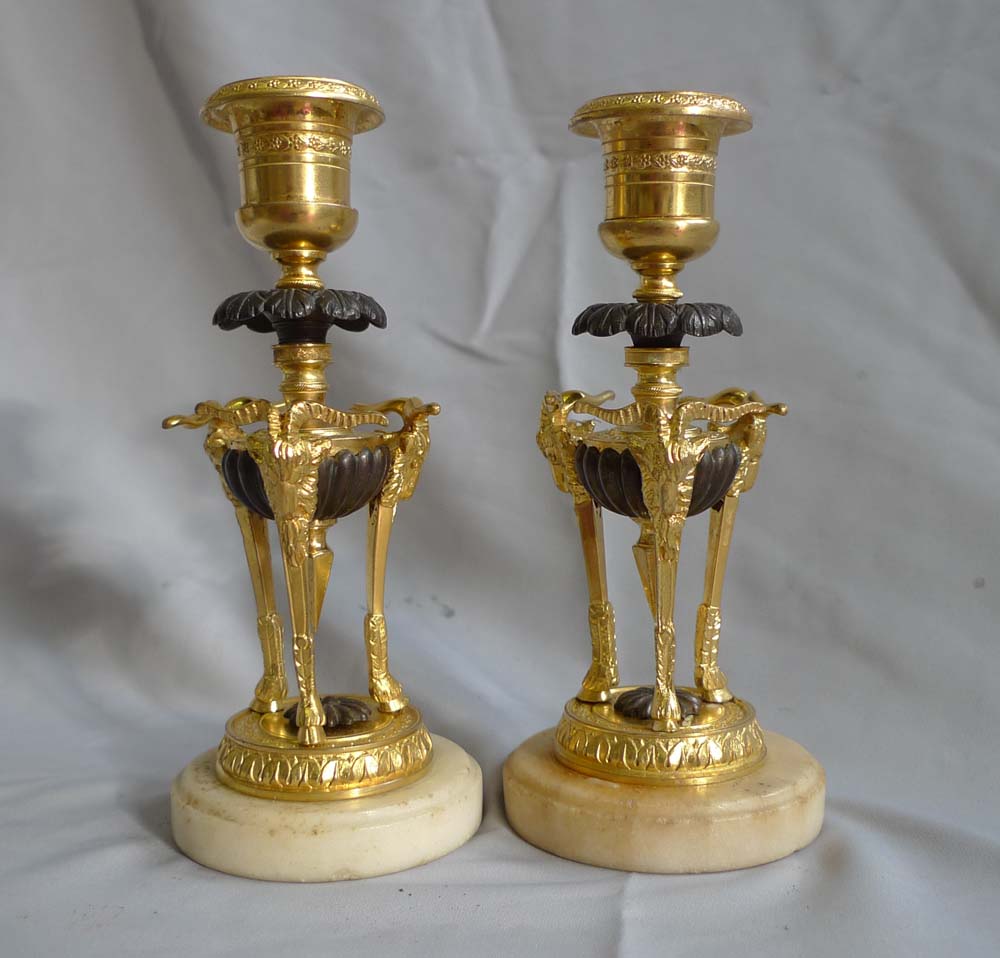 Pair antique candlesticks in ormolu, patinated bronze and marble.
