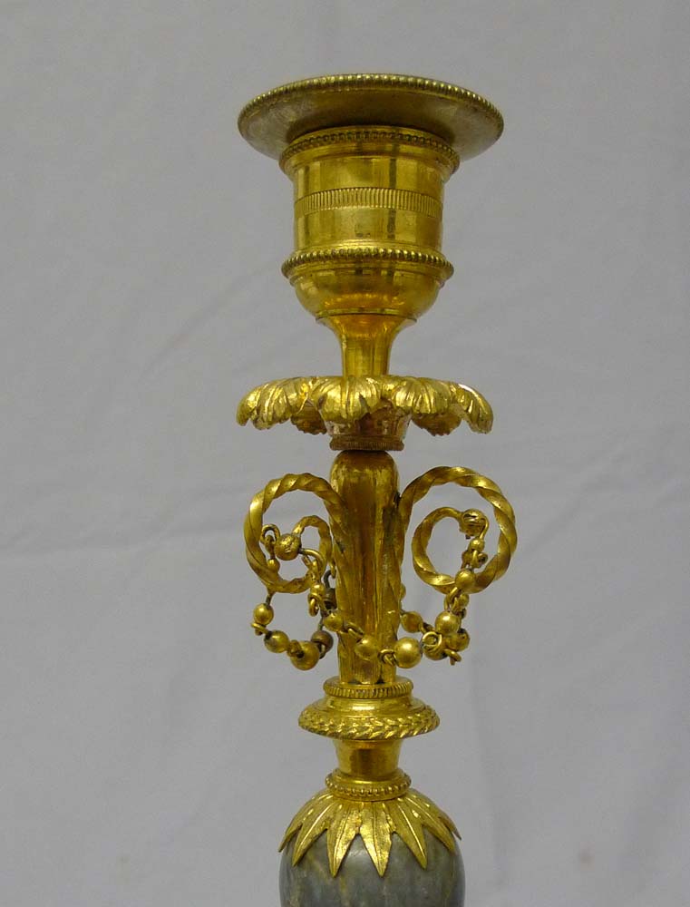Antique French Directoire candlesticks in ormolu and Bleu Tarquin marble.