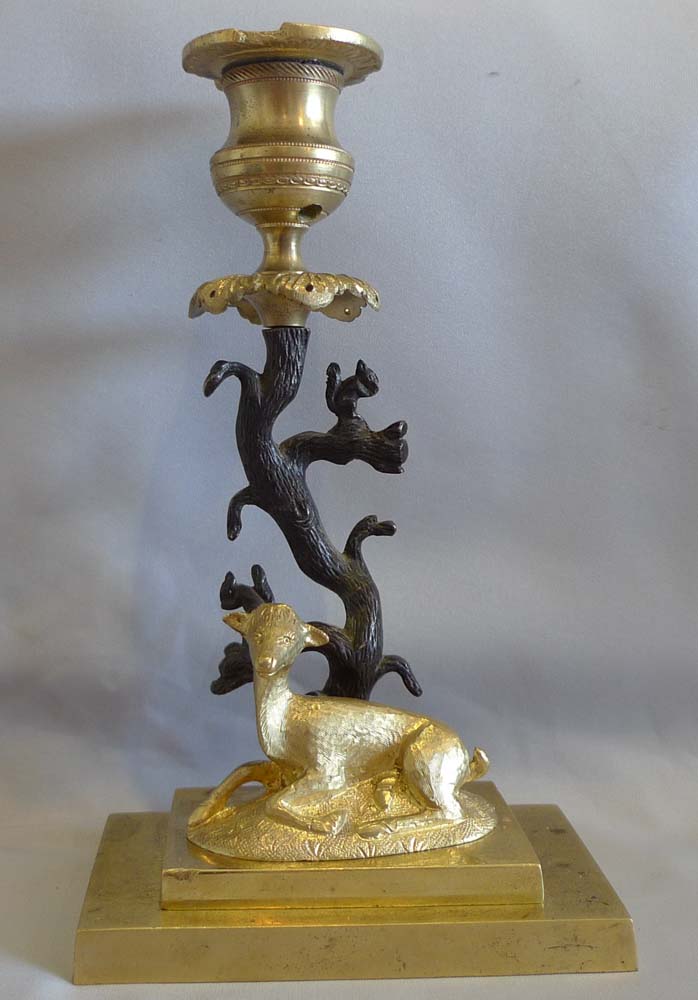 Antique English Regency candlestick of deer and squirrels in patinated bronze and ormolu.