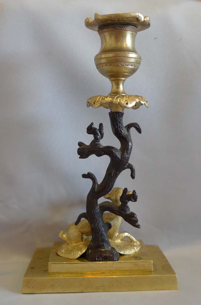 Antique English Regency candlestick of deer and squirrels in patinated bronze and ormolu.