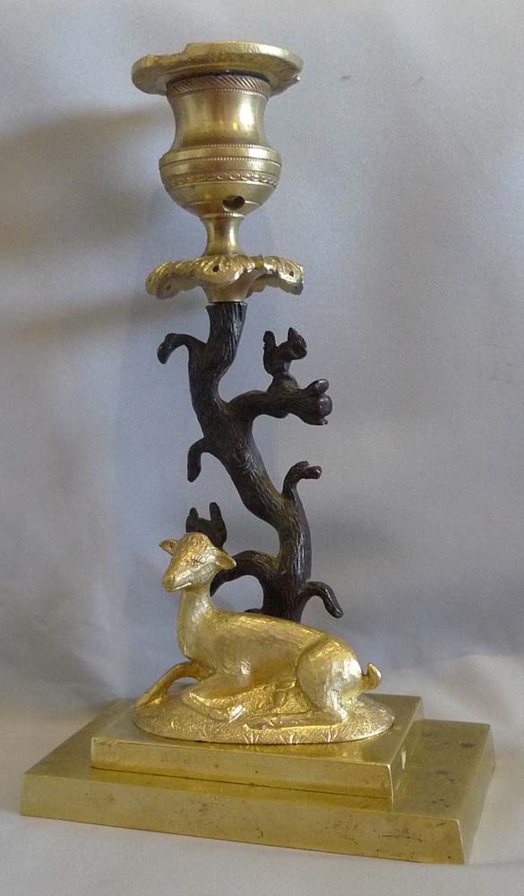 Antique English Regency candlestick of deer and squirrels in patinated bronze and ormolu.