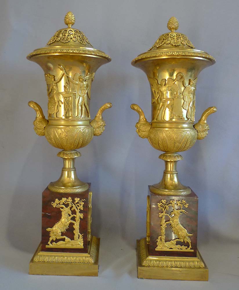Antique true pair of neo-classical ormolu and rouge marble covered urns, probably Russian.