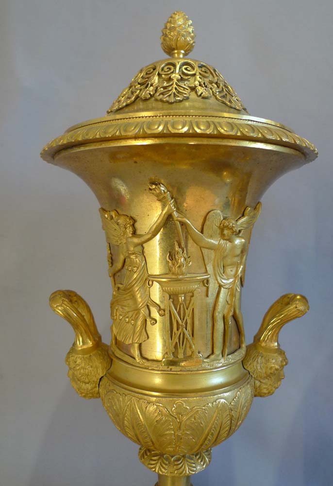 Antique true pair of neo-classical ormolu and rouge marble covered urns, probably Russian.