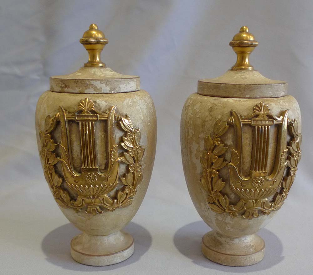 Antique pair of turned and painted covered urns with fine ormolu mounts