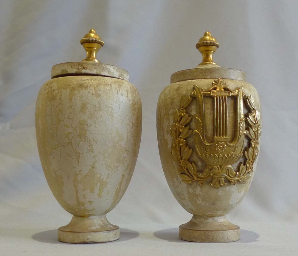 Antique pair of turned and painted covered urns with fine ormolu mounts