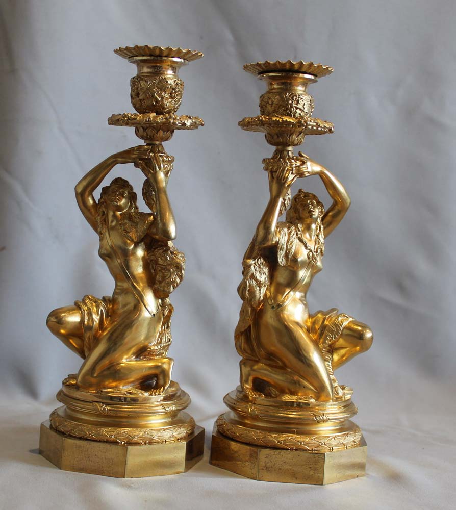 Antique Pair of French ormolu candlesticks celebrating viticulture.