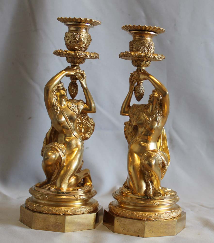 Antique Pair of French ormolu candlesticks celebrating viticulture.