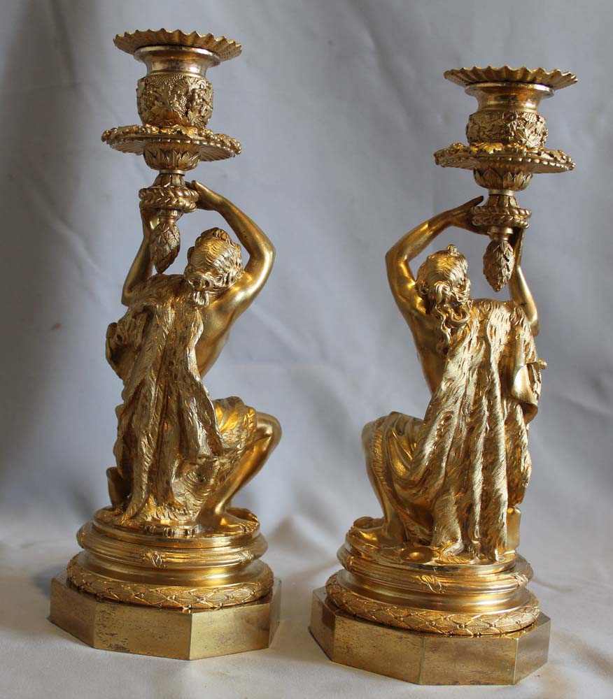 Antique Pair of French ormolu candlesticks celebrating viticulture.
