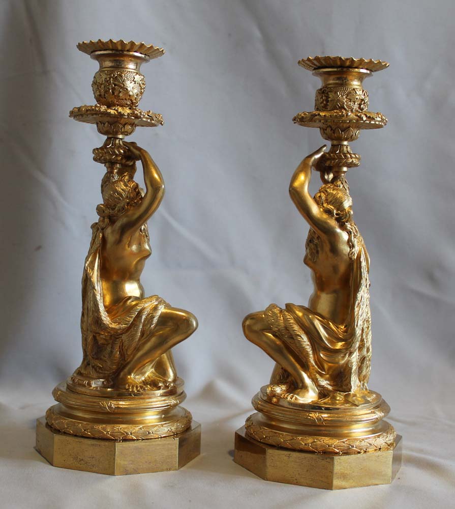 Antique Pair of French ormolu candlesticks celebrating viticulture.