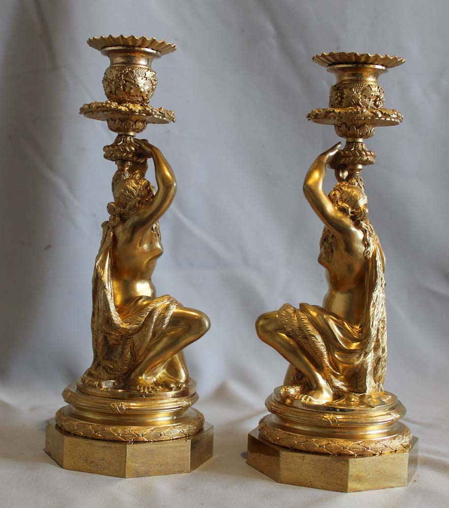 Antique Pair of French ormolu candlesticks celebrating viticulture.