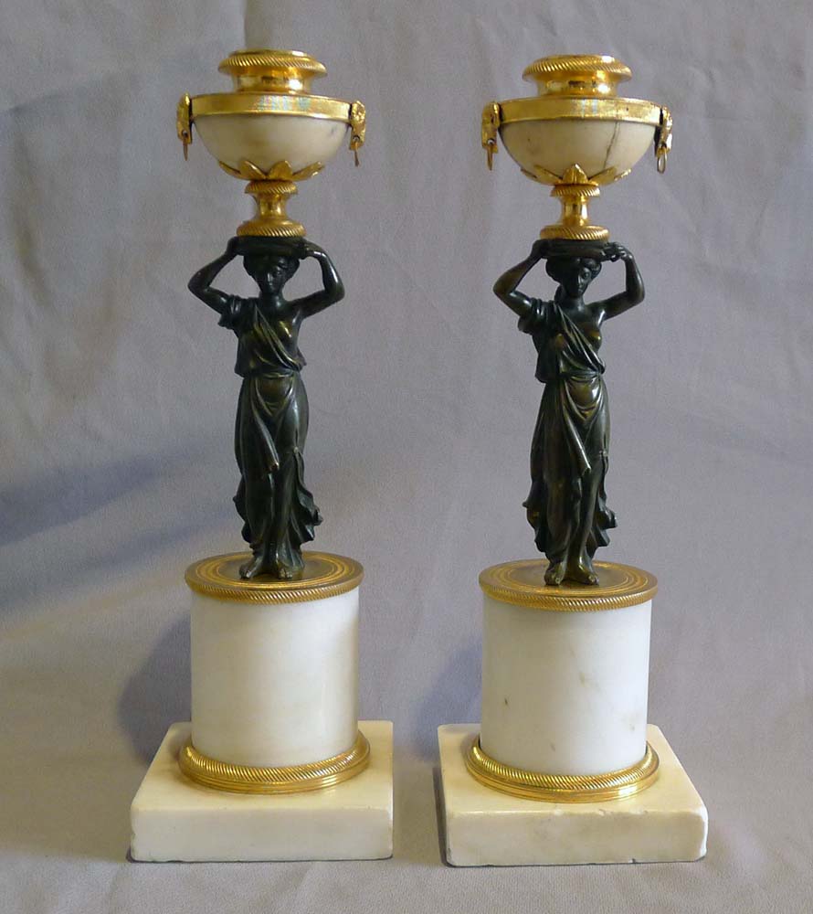 Pair of antique English Regency white marble, ormolu and patinated bronze candlesticks.