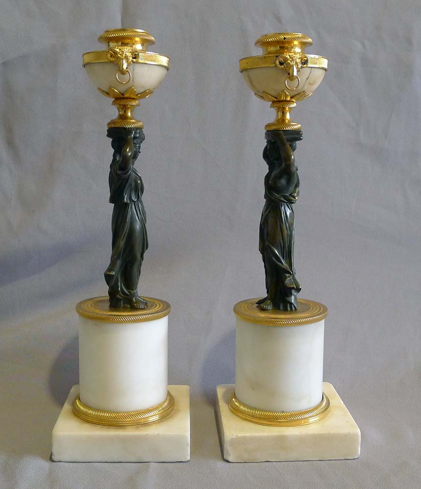 Pair of antique English Regency white marble, ormolu and patinated bronze candlesticks.