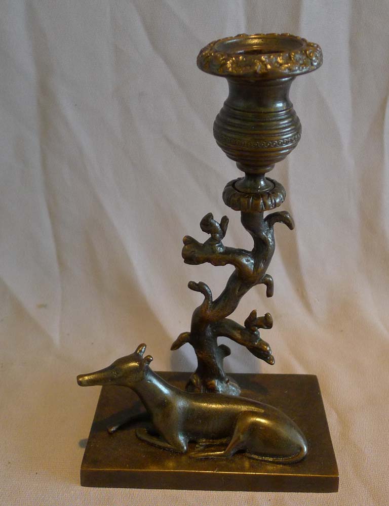Antique late English Regency naïve true pair of animalier candlesticks of greyhounds and squirrels.