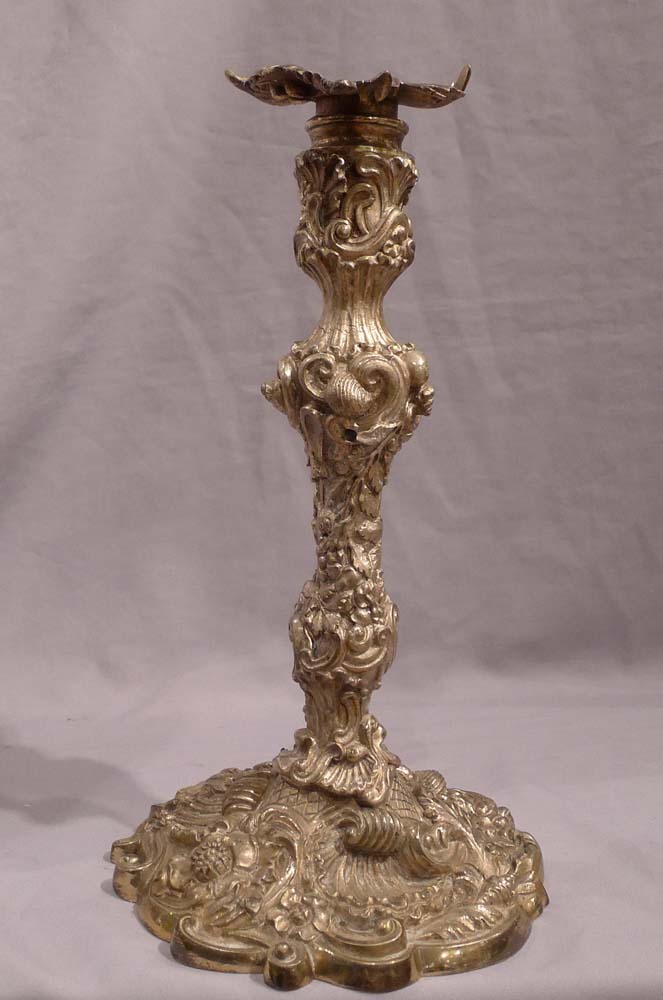 Antique pair of French ormolu candlesticks in the Louis XVth rococco style.