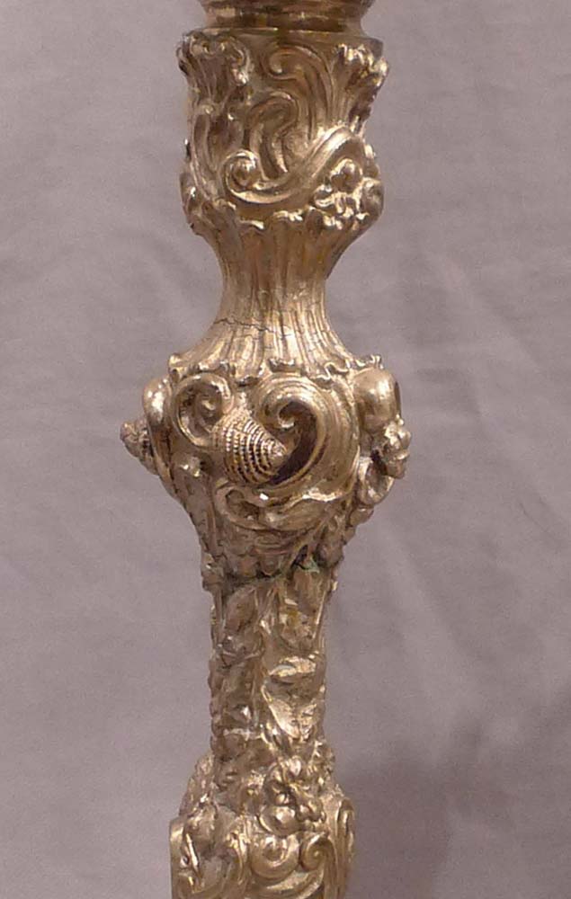 Antique pair of French ormolu candlesticks in the Louis XVth rococco style.