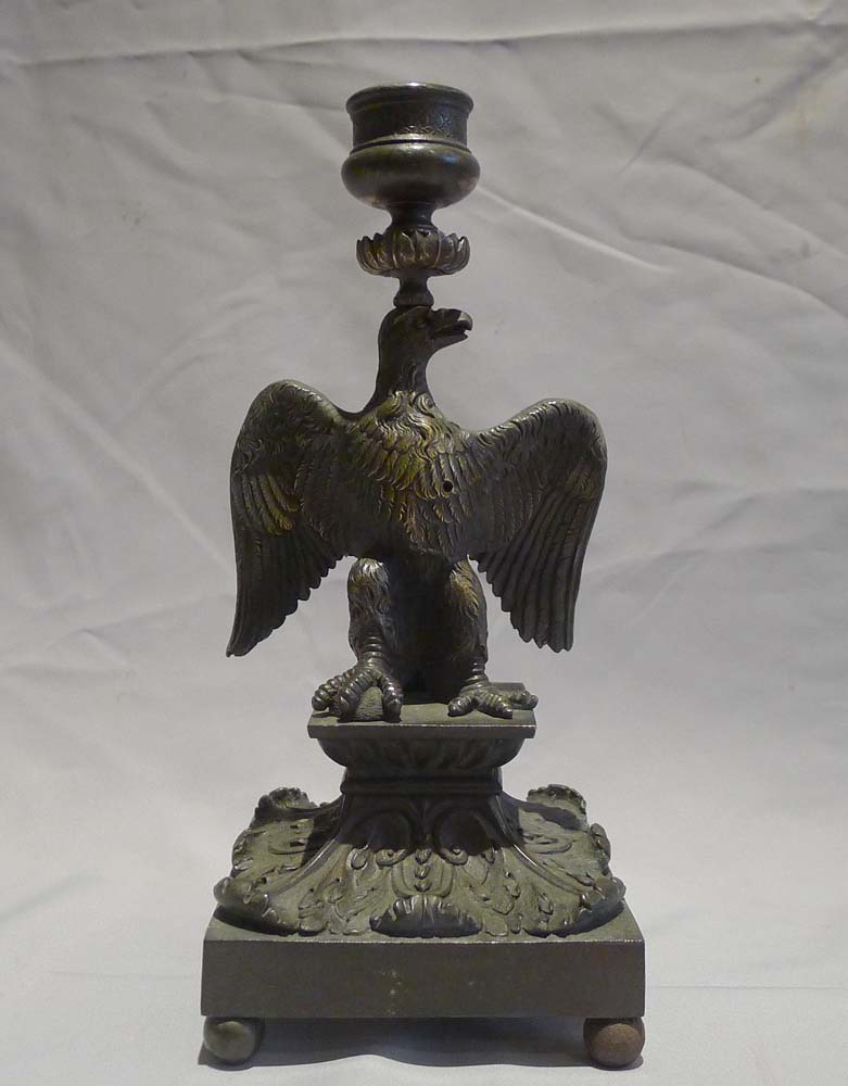 English Regency patinated bronze candlestick in the form of an eagle.
