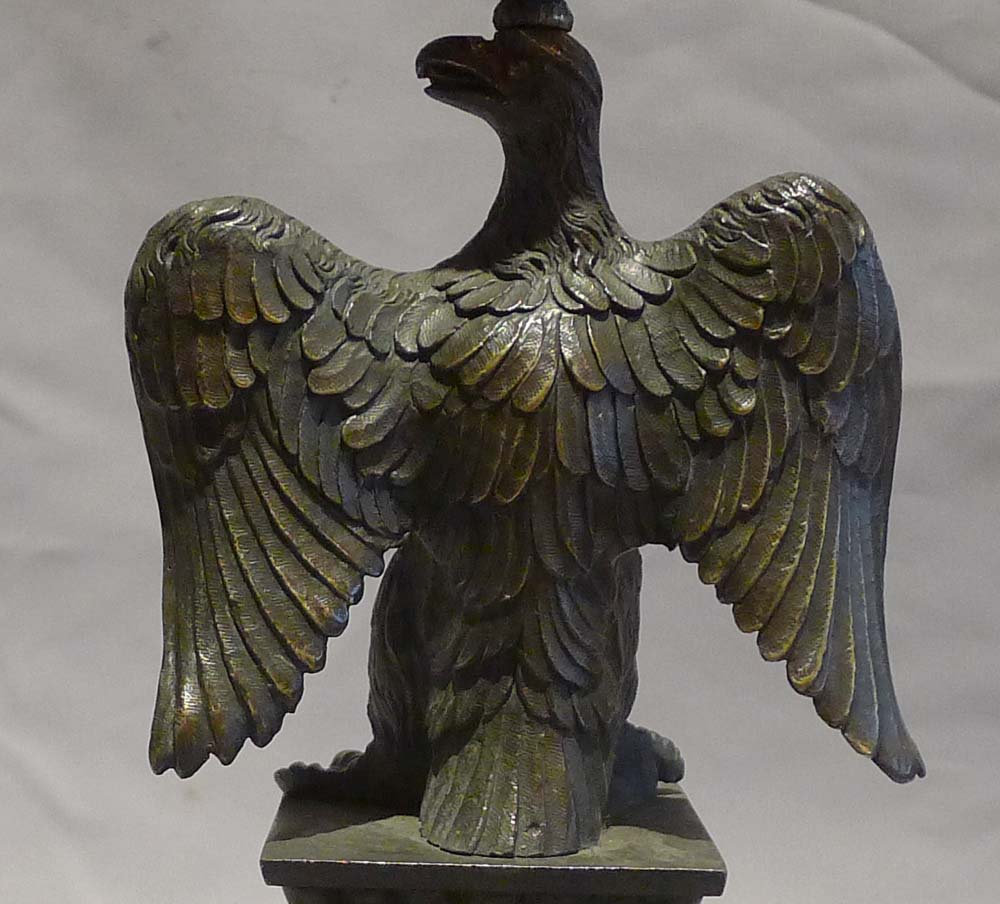 English Regency patinated bronze candlestick in the form of an eagle.