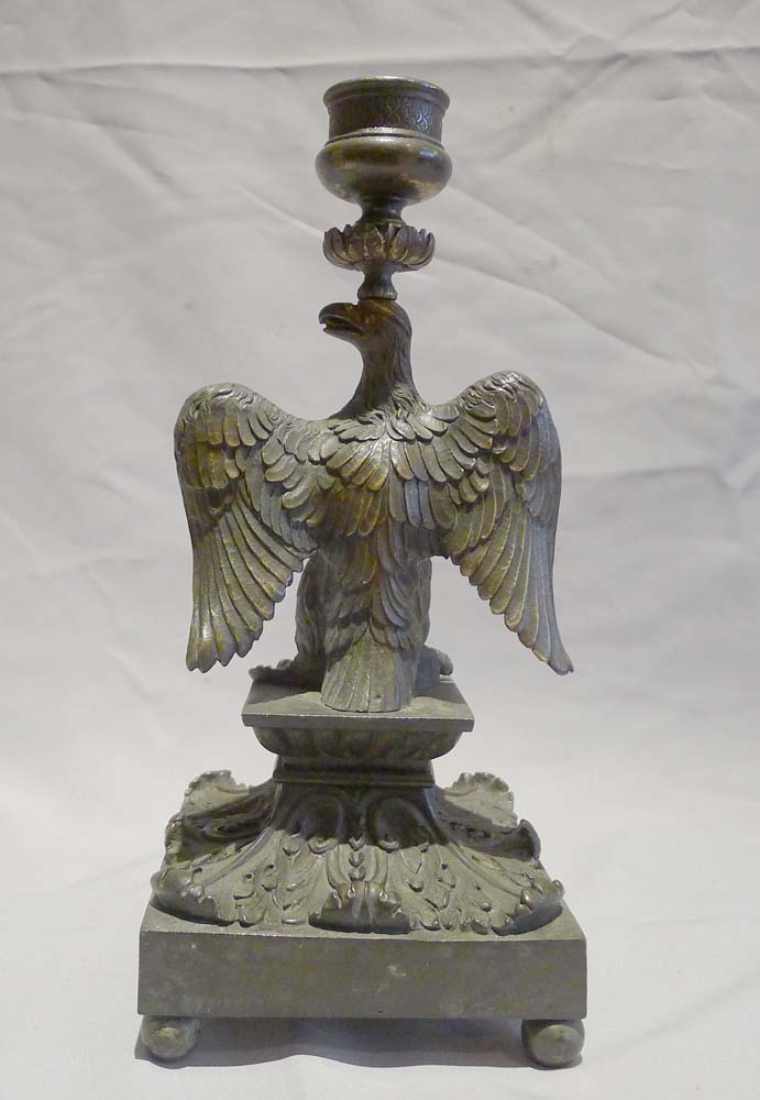 English Regency patinated bronze candlestick in the form of an eagle.