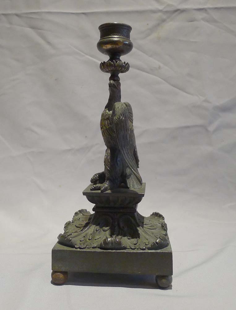 English Regency patinated bronze candlestick in the form of an eagle.