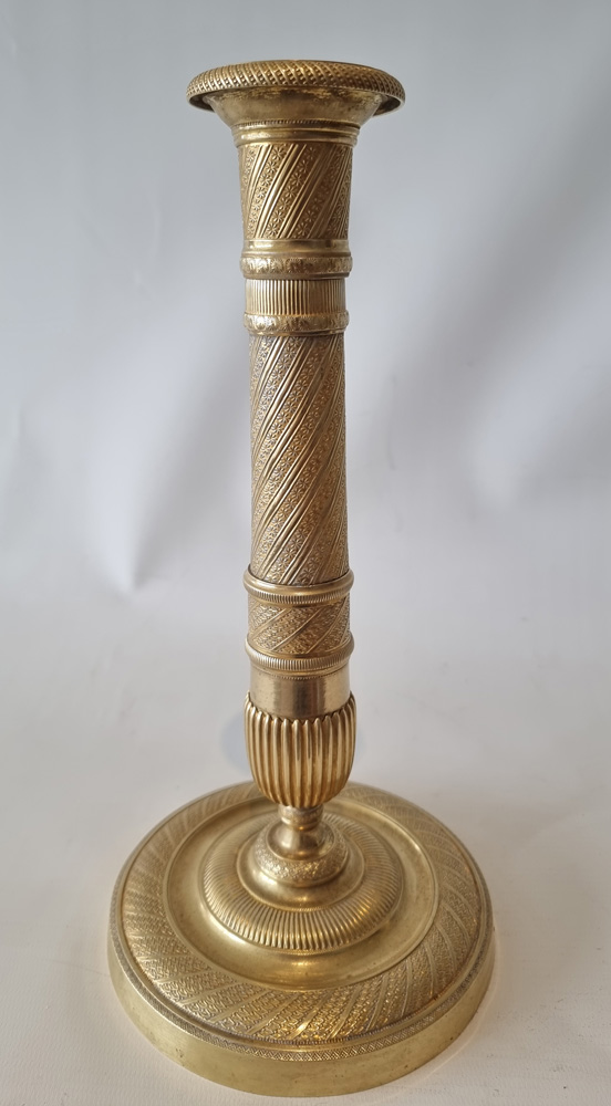Antique French Empire ormolu candlesticks.