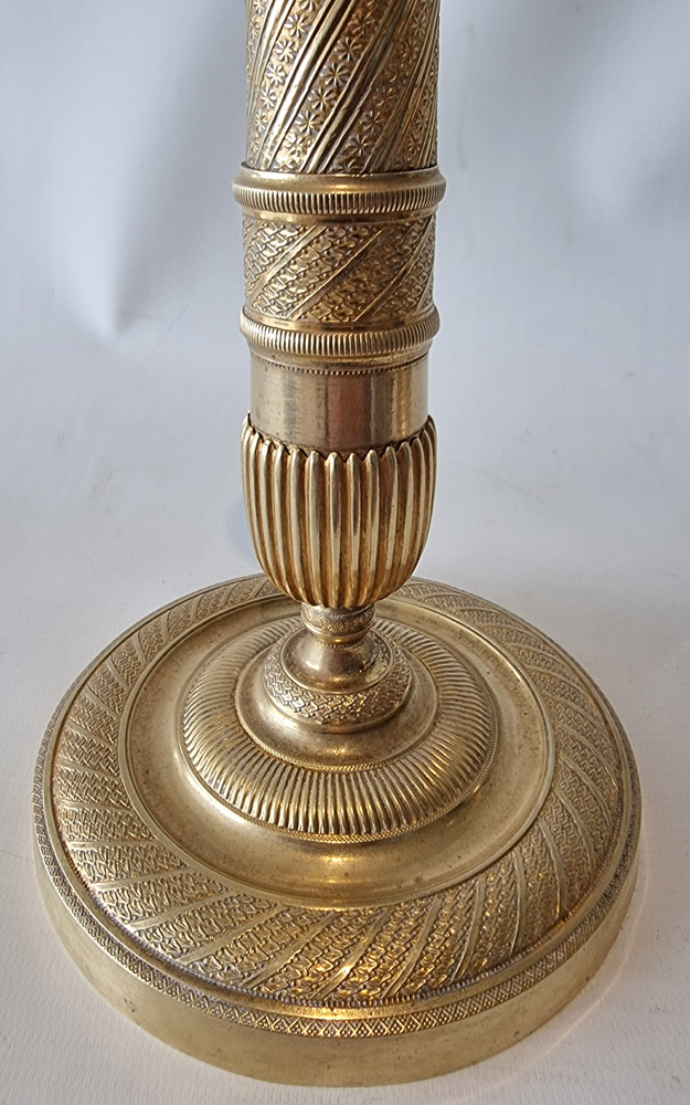 Antique French Empire ormolu candlesticks.