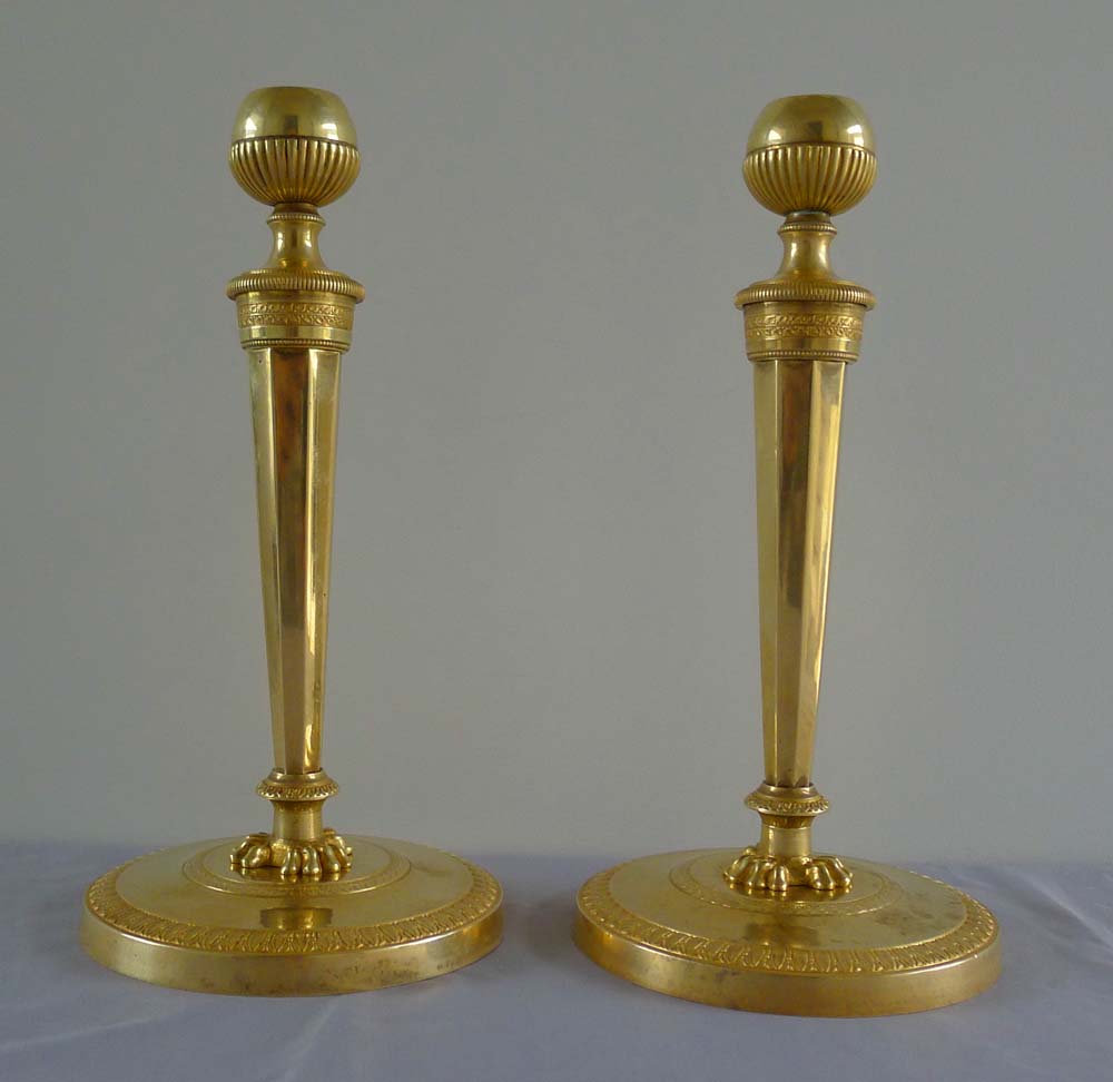 Fine antique French Empire pair of ormolu candlesticks with original hand cut threads.