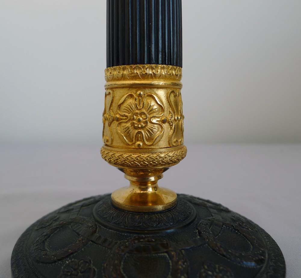 Antique pair French Charles X ormolu and patinated bronze candlesticks.
