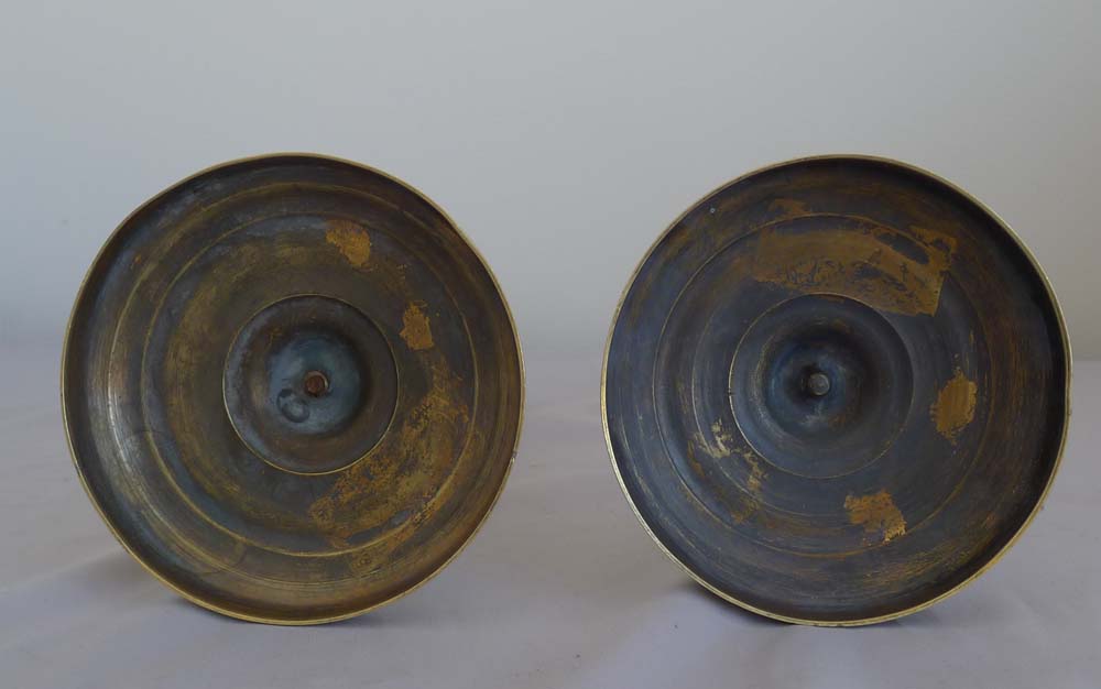 Antique pair of Charles X antique French ormolu candlesticks.