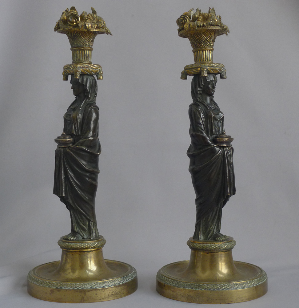 Magnificent pair of English Regency figural candlesticks in the manner of Thomas Hope.