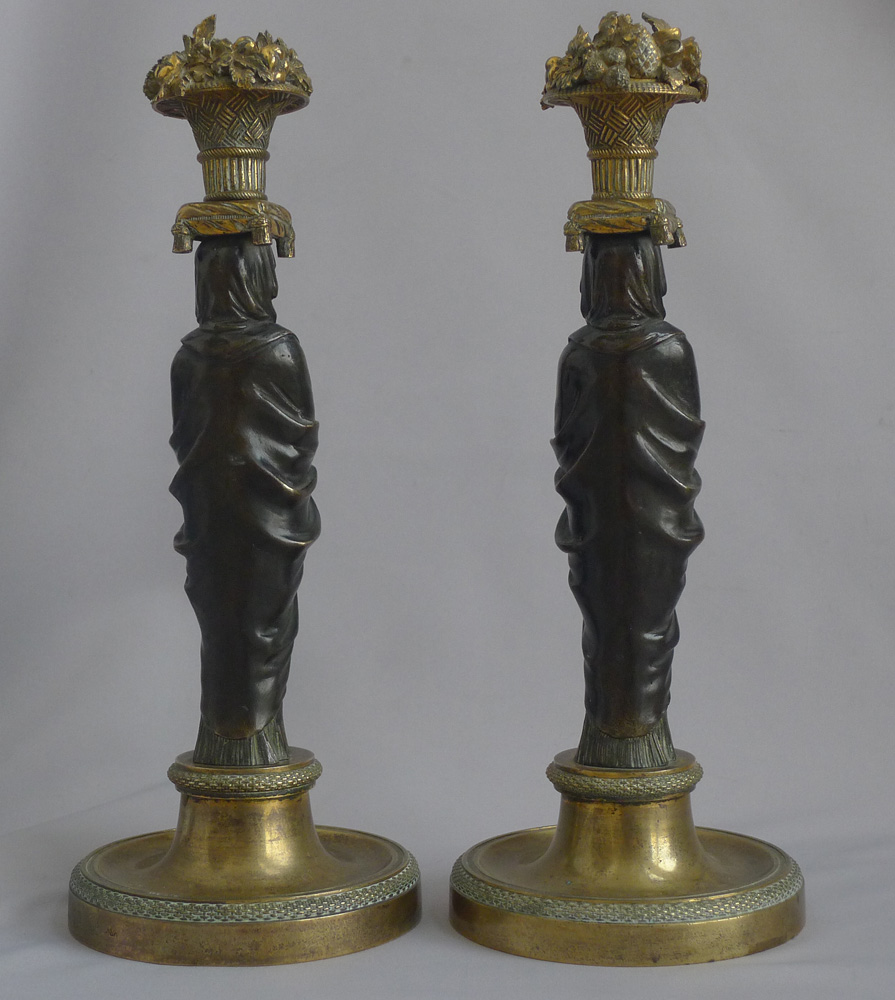 Magnificent pair of English Regency figural candlesticks in the manner of Thomas Hope.