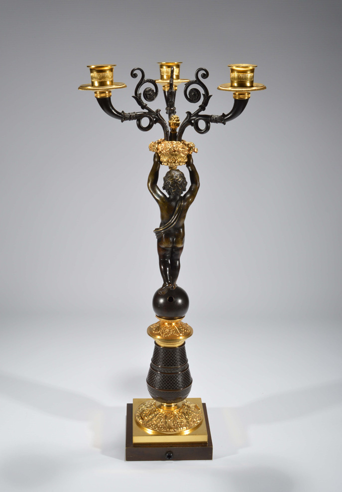 English early 19th century figural three branch candelabrum in ormolu and patinated bronze.