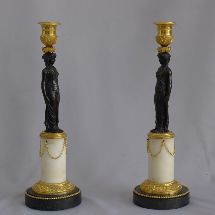 Pair of antique French Empire patinated bronze, ormolu, white & black marble figural candlesticks
