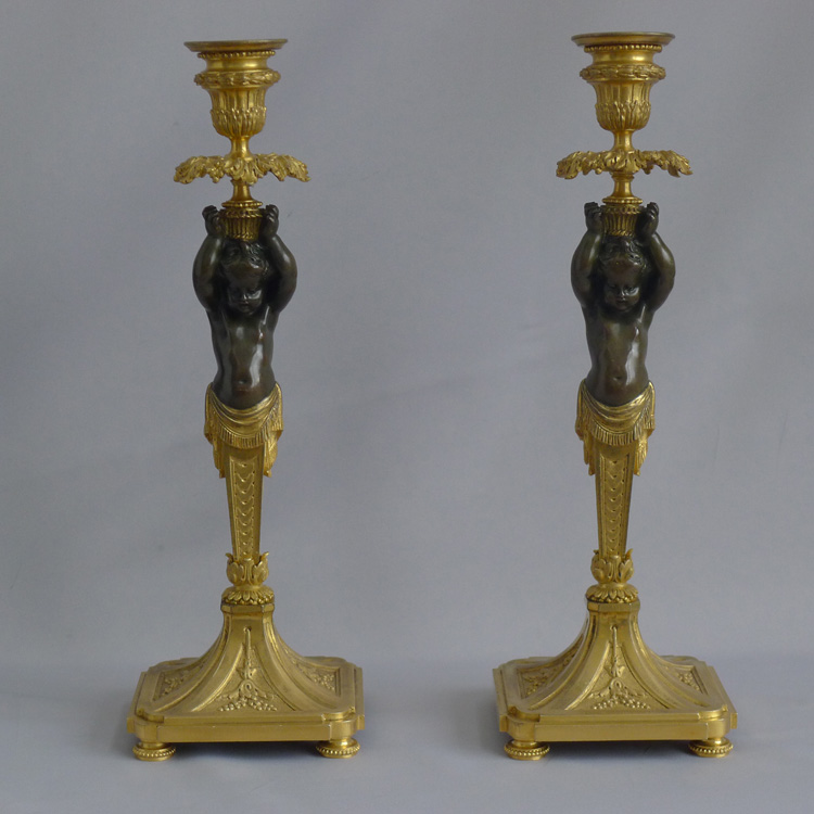 Antique French pair of ormolu and bronze figural candlesticks