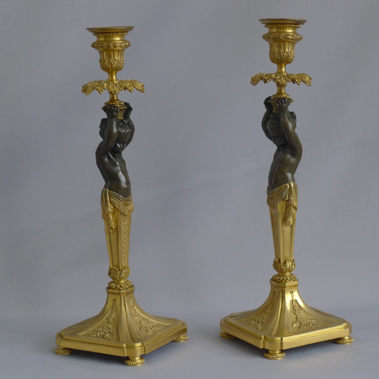 Antique French pair of ormolu and bronze figural candlesticks