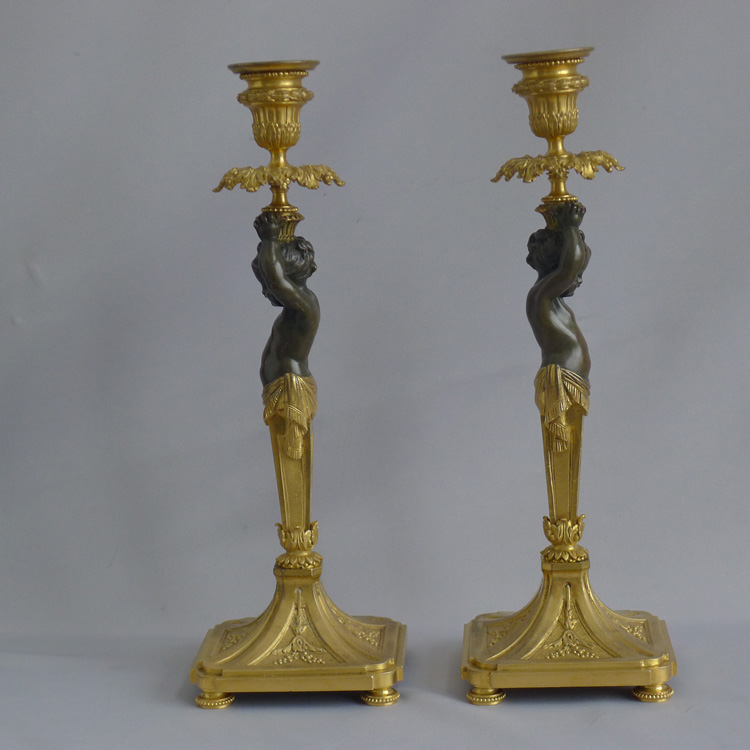 Antique French pair of ormolu and bronze figural candlesticks