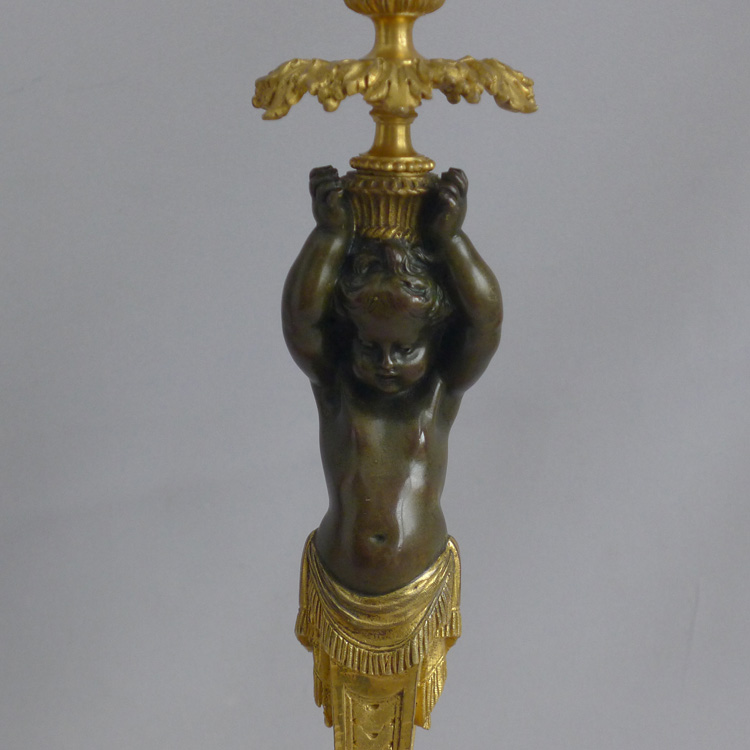 Antique French pair of ormolu and bronze figural candlesticks